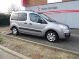 a silver van that is parked on the side of the road