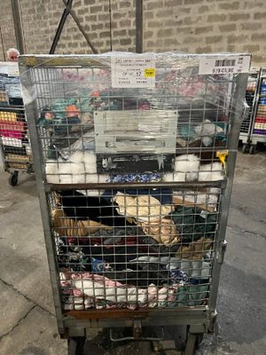 a cage with a bunch of items inside of it