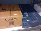 two boxes on a shelf in a store that is empty