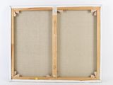 a close up of a picture frame with a piece of fabric hanging on it