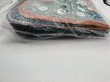 a pile of clothes wrapped in plastic on a table