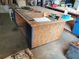 a workbench in a garage with tools on it