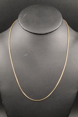 a gold chain necklace on a mannequin mannequin mannequin mannequin mannequin mannequin mannequin mannequin manne