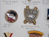 a lot of badges that are on a piece of paper