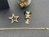 a collection of jewelry including a star, a bracelet, and a bracelet