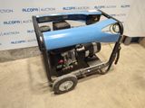 an image of a blue and black generator sitting on top of a cement floor