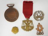 an assortment of medals including a medal, a medal, a medal, and a medal