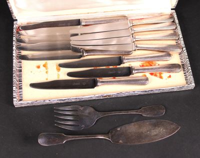 a silver tray with silverware in it on a table
