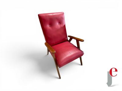 a red chair that is sitting on a white surface
