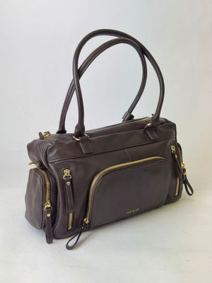 brown leather handbag with gold zippers on a white background