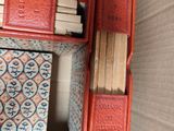 a red shelf with books on top of it in a room