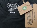 a black t - shirt with a tag on it and a tag attached to it