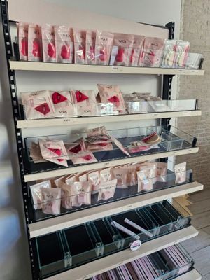 a shelf with many different items on it in a store