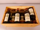 six bottles of wine in a wooden box