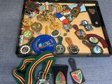 a case with a lot of medals and other items in it