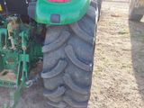 a tractor that is parked in the dirt