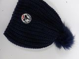 navy blue knitted hat with a pom pom on top of a mannequin mannequin mannequin mannequin mannequin manne