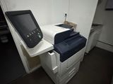 an image of a printer and a scanner in a room