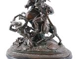 an image of a bronze statue of a man on a horse with a dog