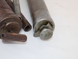 two old tools that are sitting on a table