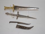 several different types of knives are displayed on a white surface