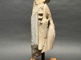 a stone statue of a woman with a veil on her head
