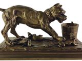 statue of a dog with a bucket of dead birds on a table