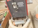 a box of tools sitting on the floor next to a box of screws