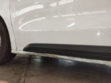 a white car that is parked in a garage