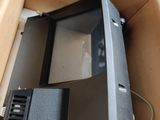 a box with a computer inside of it on the floor