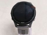 a close up of a smart watch on a clear stand