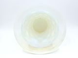 underside view of a clear glass vase with a white background