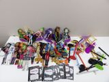 a table with a lot of dolls and other items on it