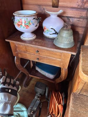 a small table with two vases on top of it