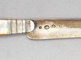 a knife that is sitting on a table