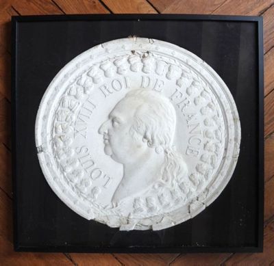 a picture of a plaque of a man in profile