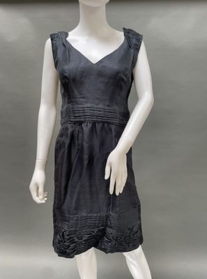 an image of a mannequin dressed in a black dress