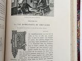 an open book with a picture of a man and a woman sitting at a table