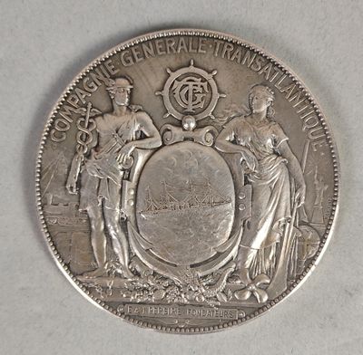 une pièce d'argent sur laquelle sont représentés une femme et un homme