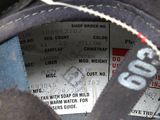 a close up of a pair of shoes with a label on it