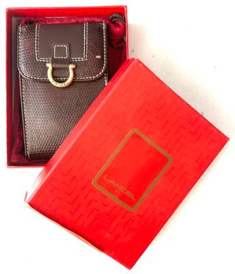 a red box with a black purse inside of it