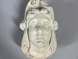 an image of a statue of a woman with a bird on her head