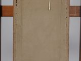an old wooden easel with a painting on top of it