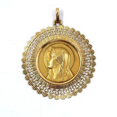 a close up of a gold medal on a white background