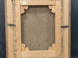 an old picture frame with a picture of a man on it