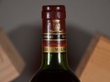 a bottle of wine that is sitting on a table