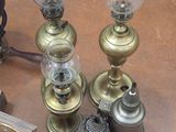 many different types of antique lamps on the table