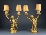 pair of antique brass figurines with lamps and shades on them