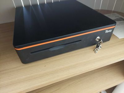 an image of a computer on a desk with a key