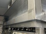an image of a machine in a factory with a lot of equipment